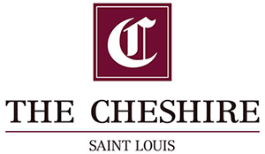 The Cheshire - Saint Louis logo above text in maroon on a white background